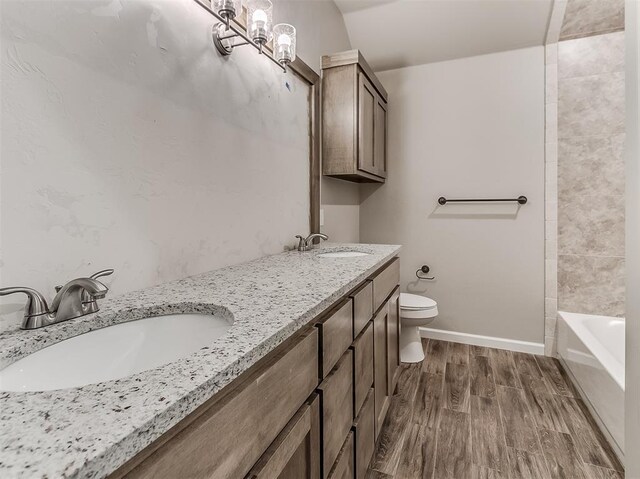600 Mirano Ln, Edmond, OK 73034 - bathroom featuring double vanity, wood finished floors, and shower / tub combination