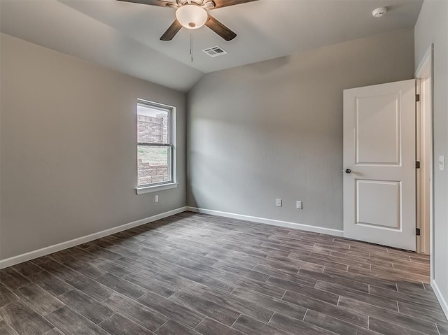 600 Mirano Ln, Edmond, OK 73034 - spare room with a ceiling fan, dark wood finished floors, a smoke detector, and vaulted ceiling