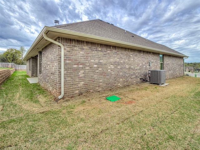 600 Mirano Ln, Edmond, OK 73034 - view of property exterior featuring brick siding and a shingled roof