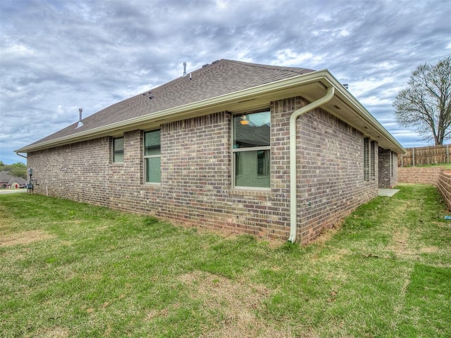 600 Mirano Ln, Edmond, OK 73034 - view of home's exterior with brick siding and roof with shingles