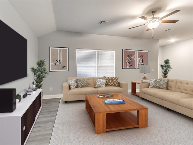11104 NW 99th St, Yukon, OK 73099 - living area with light wood finished floors, ceiling fan, and vaulted ceiling
