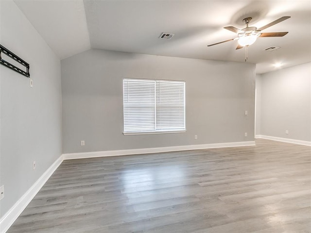 11104 NW 99th St, Yukon, OK 73099 - unfurnished room featuring ceiling fan, light wood-style flooring, and lofted ceiling