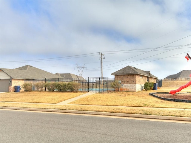 11104 NW 99th St, Yukon, OK 73099 - view of front of property featuring brick siding