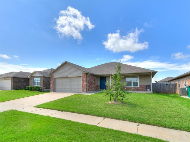 11104 NW 99th St, Yukon, OK 73099 - ranch-style home featuring brick siding, an attached garage, and concrete driveway