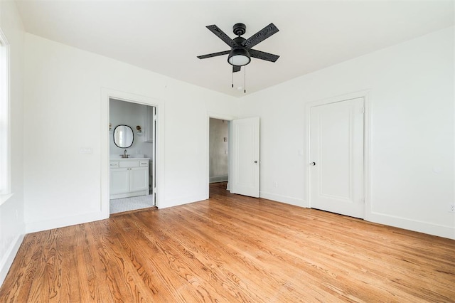 826 NE 18th St, Oklahoma City, OK 73105 - unfurnished bedroom with light wood-style floors, ensuite bath, and a ceiling fan