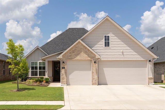 209 Pont Neuf Ct, Edmond, OK 73034 - view of front of house with driveway, a front lawn, brick siding, an attached garage, and roof with shingles