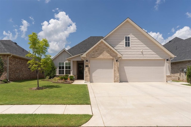 209 Pont Neuf Ct, Edmond, OK 73034 - view of front facade featuring brick siding, a front yard, and driveway