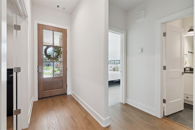209 Pont Neuf Ct, Edmond, OK 73034 - entrance foyer with light wood-type flooring and plenty of natural light