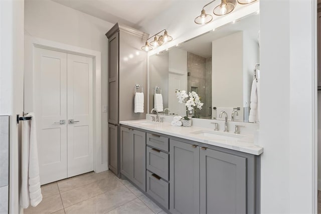 209 Pont Neuf Ct, Edmond, OK 73034 - bathroom featuring double vanity, tiled shower, and tile patterned floors