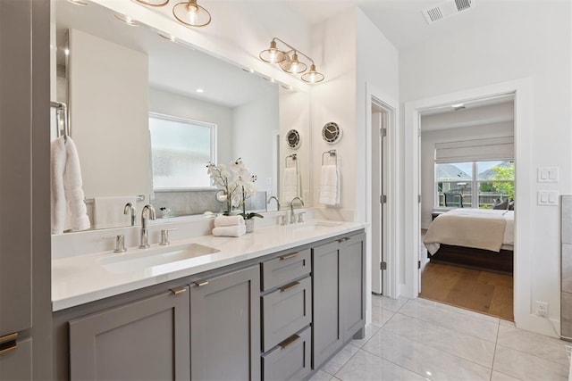209 Pont Neuf Ct, Edmond, OK 73034 - full bath featuring double vanity, ensuite bath, and tile patterned flooring