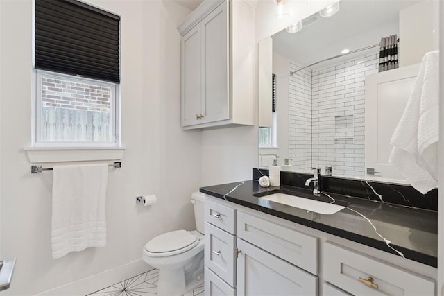 209 Pont Neuf Ct, Edmond, OK 73034 - bathroom featuring vanity, plenty of natural light, a shower, and tile patterned flooring
