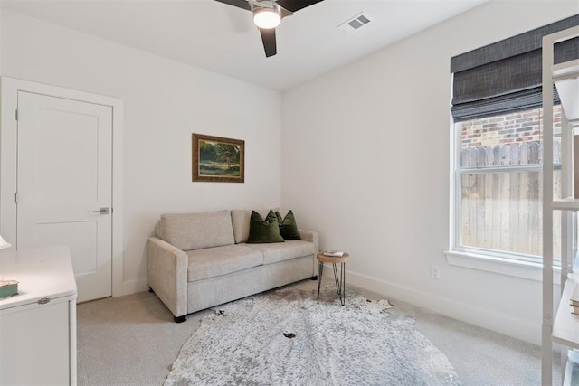 209 Pont Neuf Ct, Edmond, OK 73034 - living room with light carpet, a ceiling fan, and healthy amount of natural light