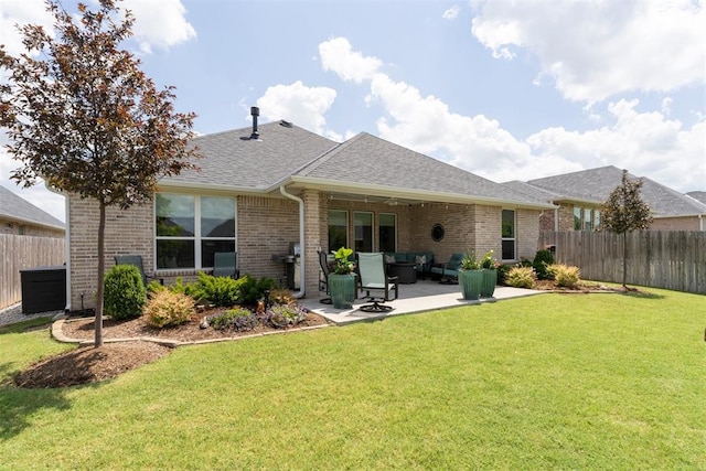 209 Pont Neuf Ct, Edmond, OK 73034 - rear view of property with brick siding, a fenced backyard, a shingled roof, a patio area, and an outdoor hangout area