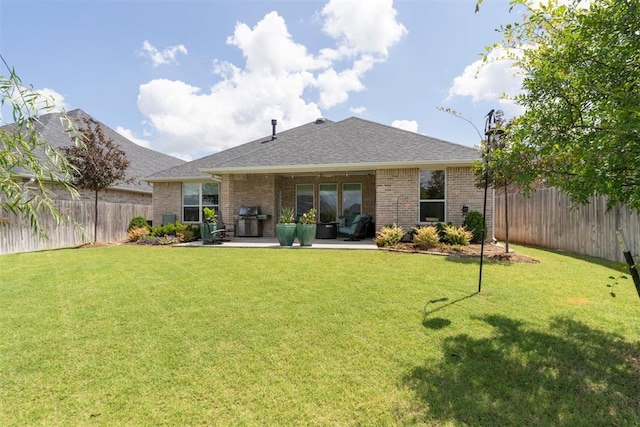 209 Pont Neuf Ct, Edmond, OK 73034 - rear view of property with brick siding, roof with shingles, and a patio