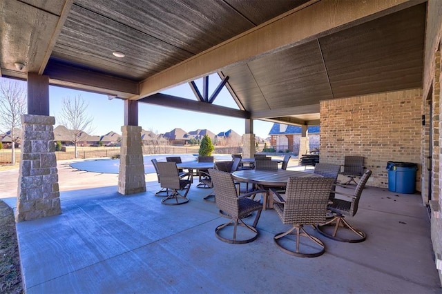 209 Pont Neuf Ct, Edmond, OK 73034 - view of patio with outdoor dining area and a residential view