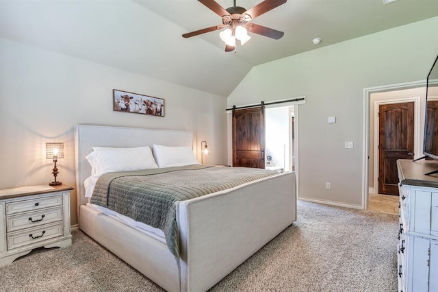 10812 Wild Horse Creek Dr, Yukon, OK 73099 - bedroom with lofted ceiling, light colored carpet, a barn door, and ceiling fan