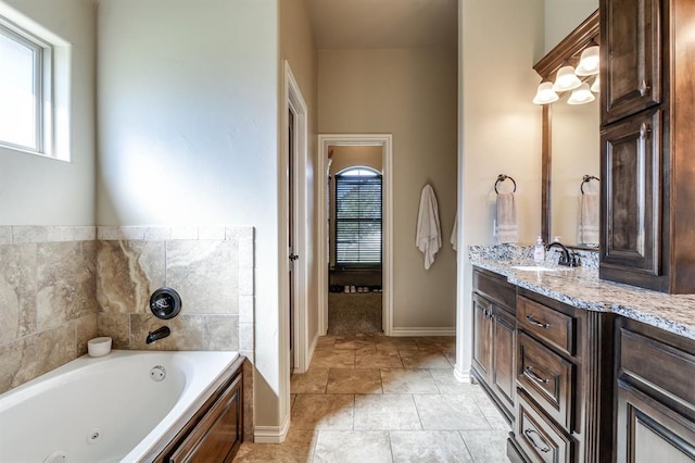 10812 Wild Horse Creek Dr, Yukon, OK 73099 - bathroom featuring a tub with jets and vanity