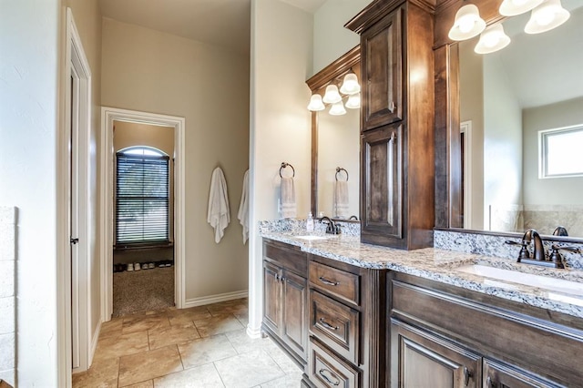 10812 Wild Horse Creek Dr, Yukon, OK 73099 - bathroom with double vanity and baseboards