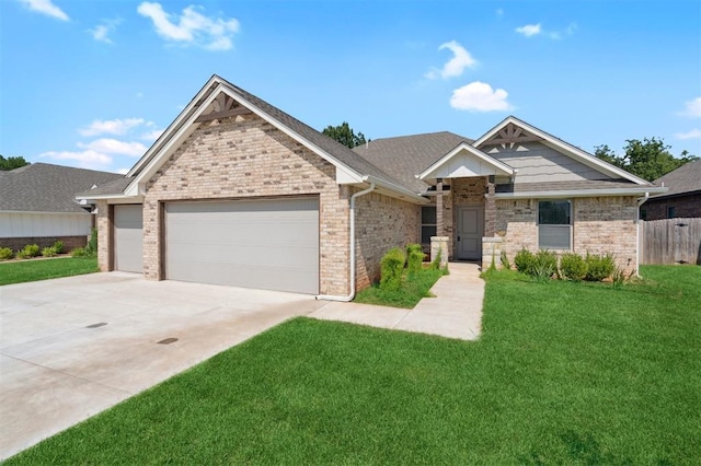 1512 N Kamryn Way, Mustang, OK 73064 - view of front of home featuring a garage, driveway, and brick siding