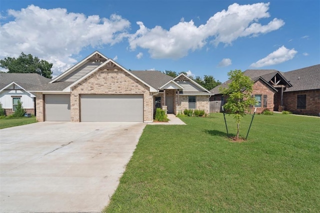 1512 N Kamryn Way, Mustang, OK 73064 - view of front of property featuring brick siding, a garage, a front lawn, and concrete driveway