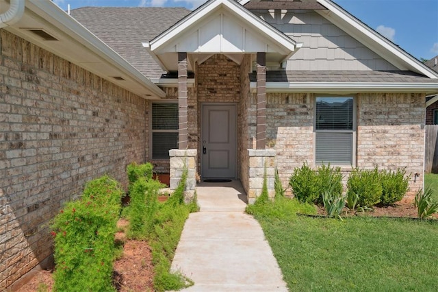 1512 N Kamryn Way, Mustang, OK 73064 - property entrance with brick siding and roof with shingles