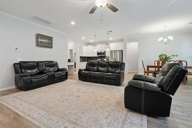 1512 N Kamryn Way, Mustang, OK 73064 - living area featuring a chandelier, ceiling fan, light wood-style floors, recessed lighting, and crown molding