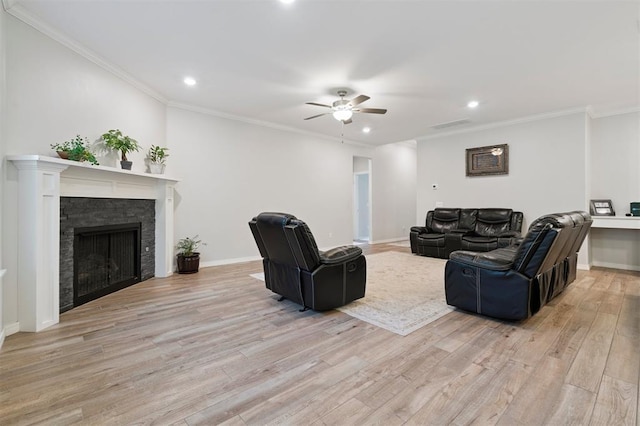 1512 N Kamryn Way, Mustang, OK 73064 - living room with recessed lighting, light wood finished floors, a ceiling fan, a fireplace, and crown molding