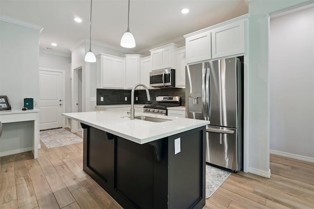 1512 N Kamryn Way, Mustang, OK 73064 - kitchen featuring appliances with stainless steel finishes, crown molding, backsplash, white cabinets, and light wood-style flooring