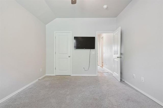 1512 N Kamryn Way, Mustang, OK 73064 - unfurnished bedroom with light carpet, lofted ceiling, and a ceiling fan