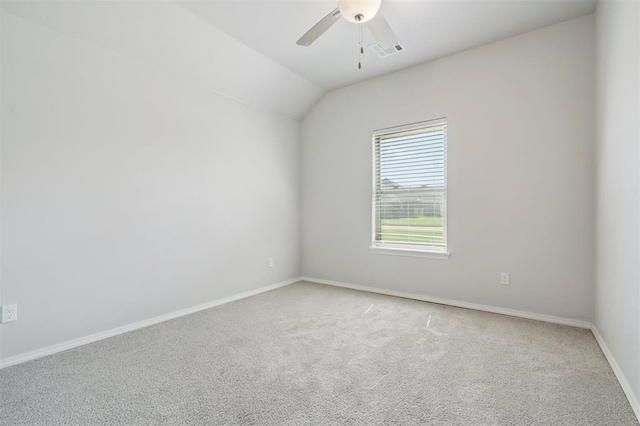 1512 N Kamryn Way, Mustang, OK 73064 - spare room featuring carpet, ceiling fan, and vaulted ceiling