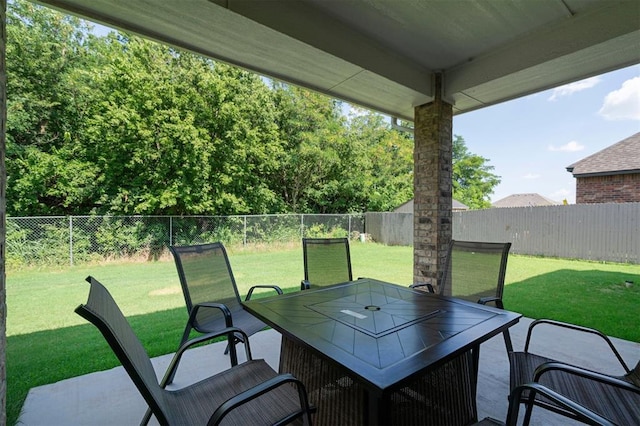 1512 N Kamryn Way, Mustang, OK 73064 - fenced backyard featuring outdoor dining space and a patio