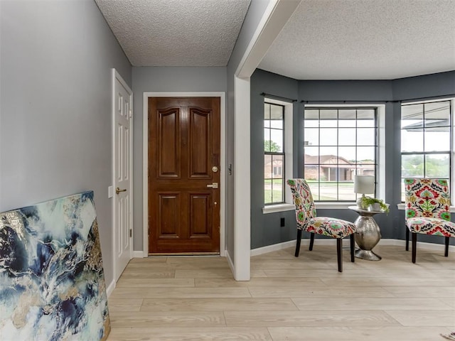 5412 Cloverlawn Dr, Oklahoma City, OK 73135 - foyer with a textured ceiling and light wood-style flooring