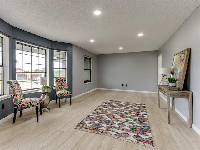 5412 Cloverlawn Dr, Oklahoma City, OK 73135 - sitting room with a textured ceiling, light wood-style flooring, and recessed lighting