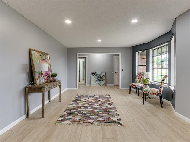 5412 Cloverlawn Dr, Oklahoma City, OK 73135 - living area featuring a textured ceiling, light wood finished floors, and recessed lighting
