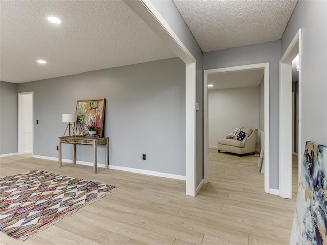 5412 Cloverlawn Dr, Oklahoma City, OK 73135 - entrance foyer featuring a textured ceiling, light wood-style floors, and recessed lighting