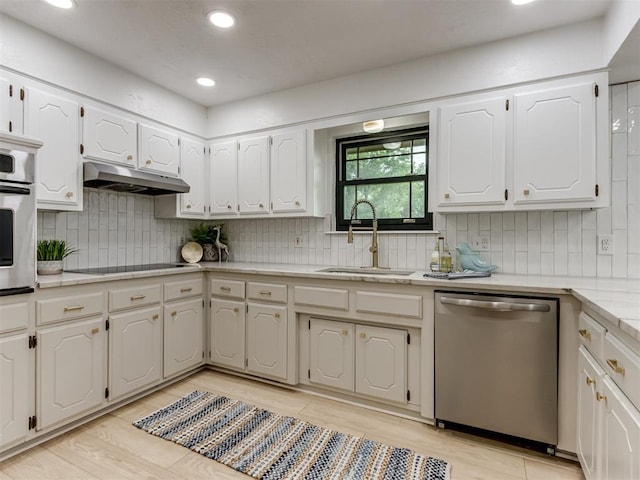 5412 Cloverlawn Dr, Oklahoma City, OK 73135 - kitchen featuring stainless steel appliances, white cabinets, tasteful backsplash, light wood finished floors, and recessed lighting
