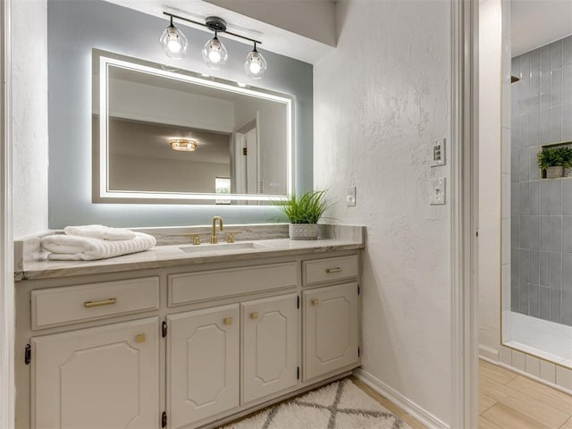 5412 Cloverlawn Dr, Oklahoma City, OK 73135 - full bathroom with vanity, tiled shower, and a textured wall