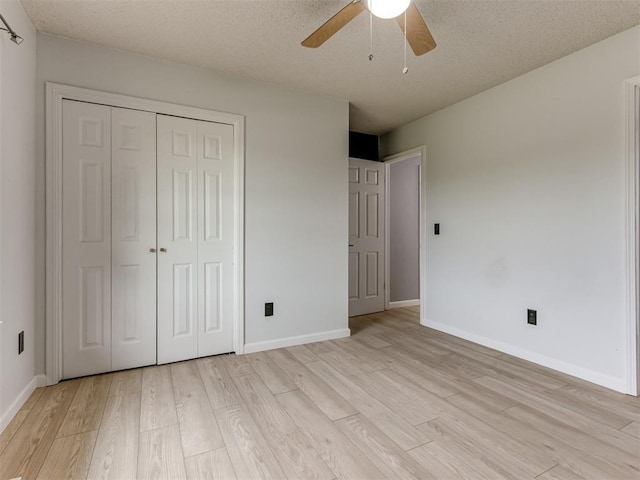 5412 Cloverlawn Dr, Oklahoma City, OK 73135 - unfurnished bedroom featuring light wood finished floors, a closet, a ceiling fan, and a textured ceiling