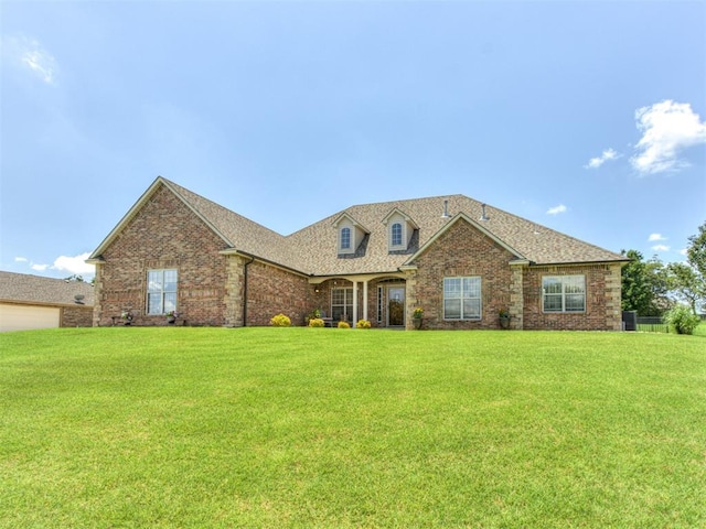 559 Silver Tree Cir, Choctaw, OK 73020 - view of front of property featuring a front lawn, brick siding, and a shingled roof