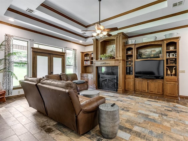 559 Silver Tree Cir, Choctaw, OK 73020 - living room with ornamental molding, a raised ceiling, a premium fireplace, stone tile floors, and recessed lighting