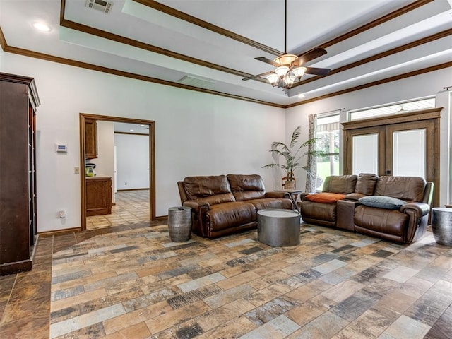 559 Silver Tree Cir, Choctaw, OK 73020 - living room featuring a ceiling fan, ornamental molding, a raised ceiling, stone tile floors, and french doors