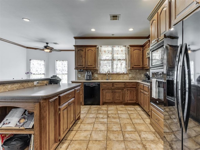 559 Silver Tree Cir, Choctaw, OK 73020 - kitchen featuring black appliances, ornamental molding, plenty of natural light, backsplash, and a ceiling fan