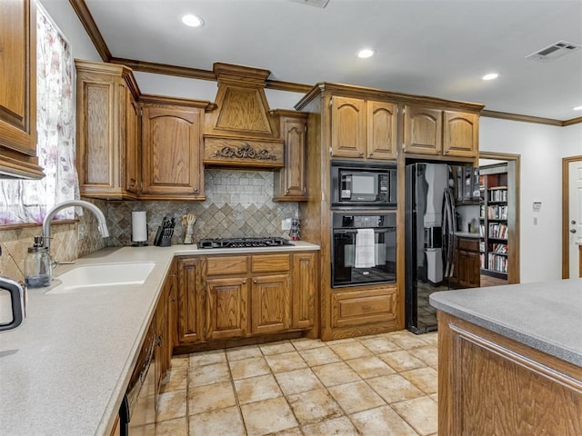 559 Silver Tree Cir, Choctaw, OK 73020 - kitchen with black appliances, crown molding, backsplash, light countertops, and recessed lighting