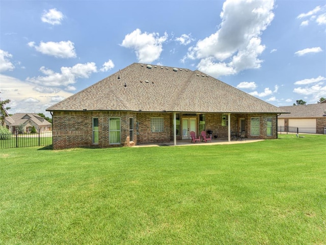 559 Silver Tree Cir, Choctaw, OK 73020 - back of house featuring a patio area, a shingled roof, and brick siding