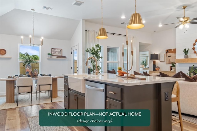 449 Vista Dr, Yukon, OK 73099 - kitchen featuring open floor plan, light wood-style flooring, a ceiling fan, lofted ceiling, and a chandelier