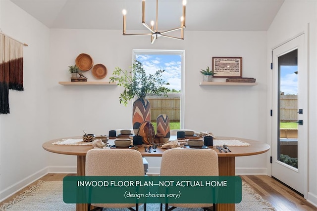 449 Vista Dr, Yukon, OK 73099 - dining space featuring a chandelier, plenty of natural light, and wood finished floors