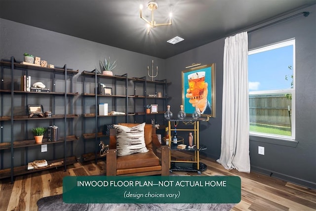449 Vista Dr, Yukon, OK 73099 - sitting room featuring wood finished floors and a chandelier