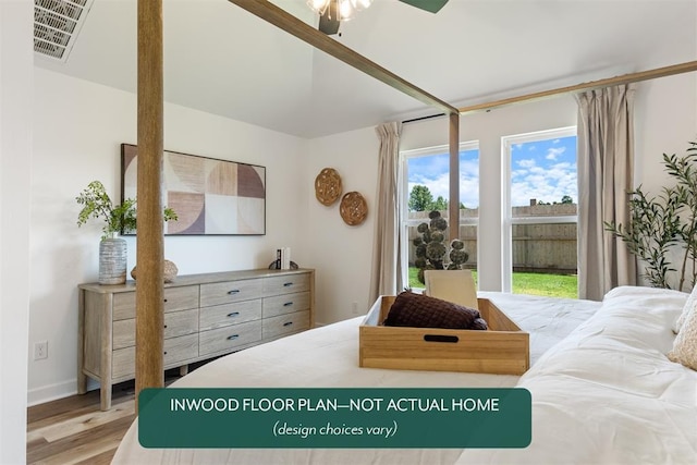449 Vista Dr, Yukon, OK 73099 - bedroom featuring wood finished floors and baseboards