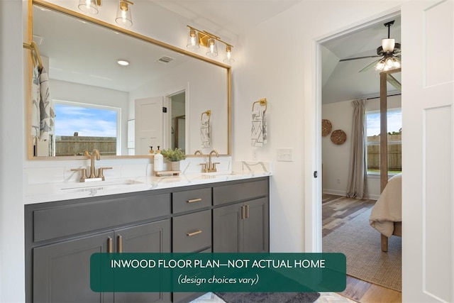 449 Vista Dr, Yukon, OK 73099 - bathroom featuring double vanity, wood finished floors, and a ceiling fan