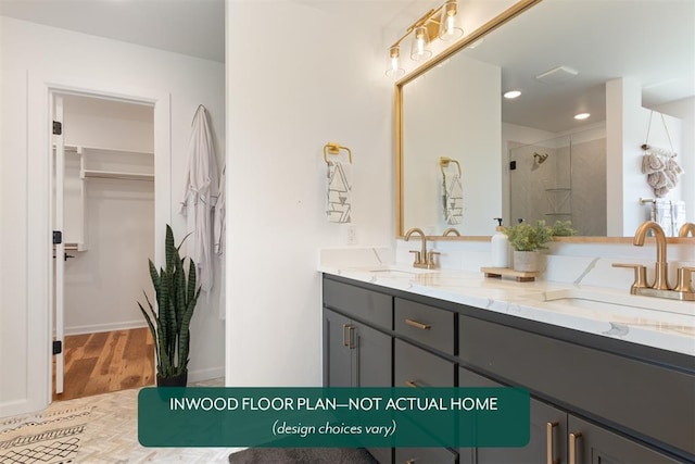 449 Vista Dr, Yukon, OK 73099 - full bathroom with double vanity, a stall shower, wood finished floors, a walk in closet, and recessed lighting